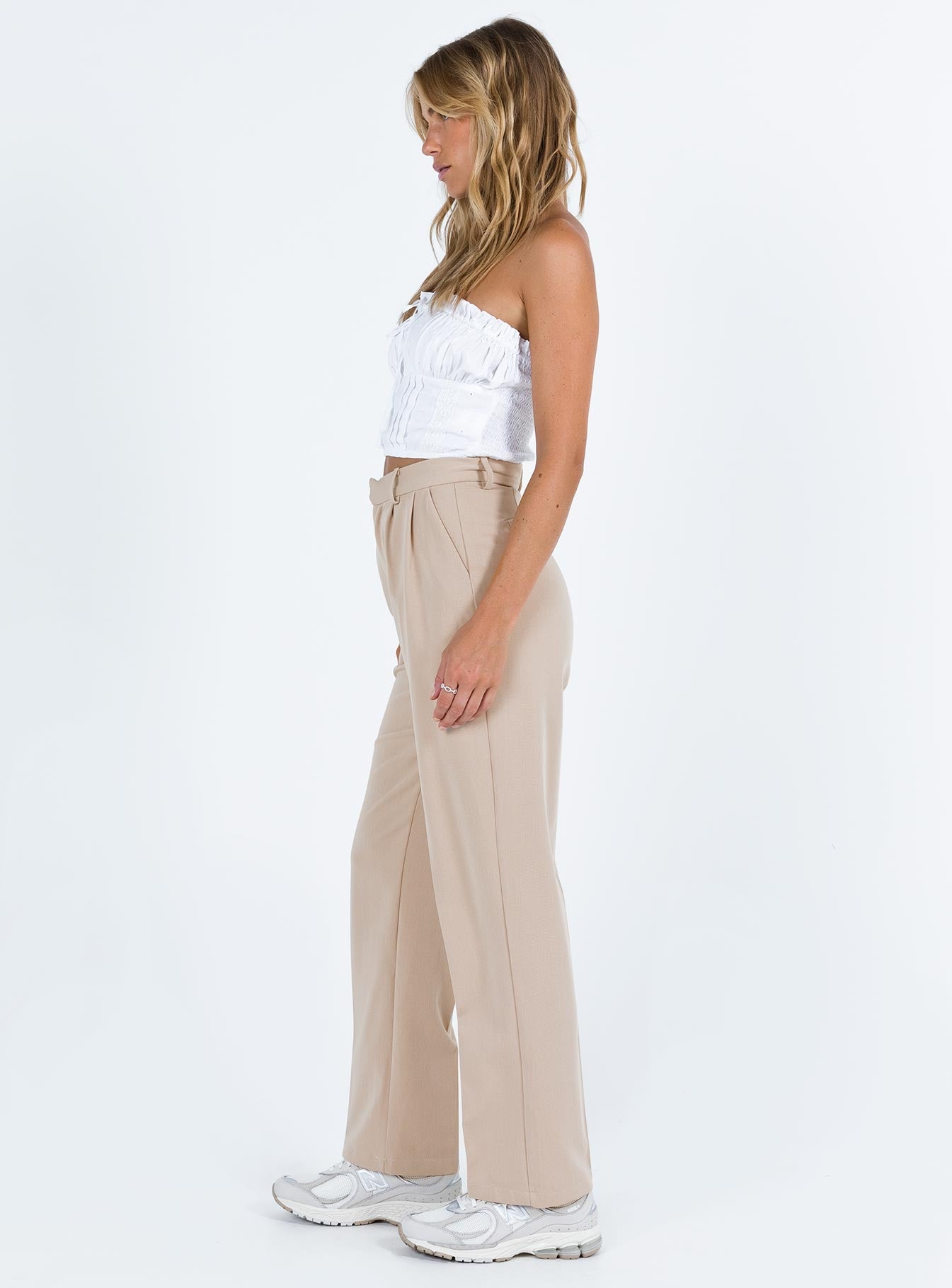 Beige tailored pants High rise Belt looped waist Zip and clasp fastening Stuble pleats at waist Twin hip pockets Straight leg