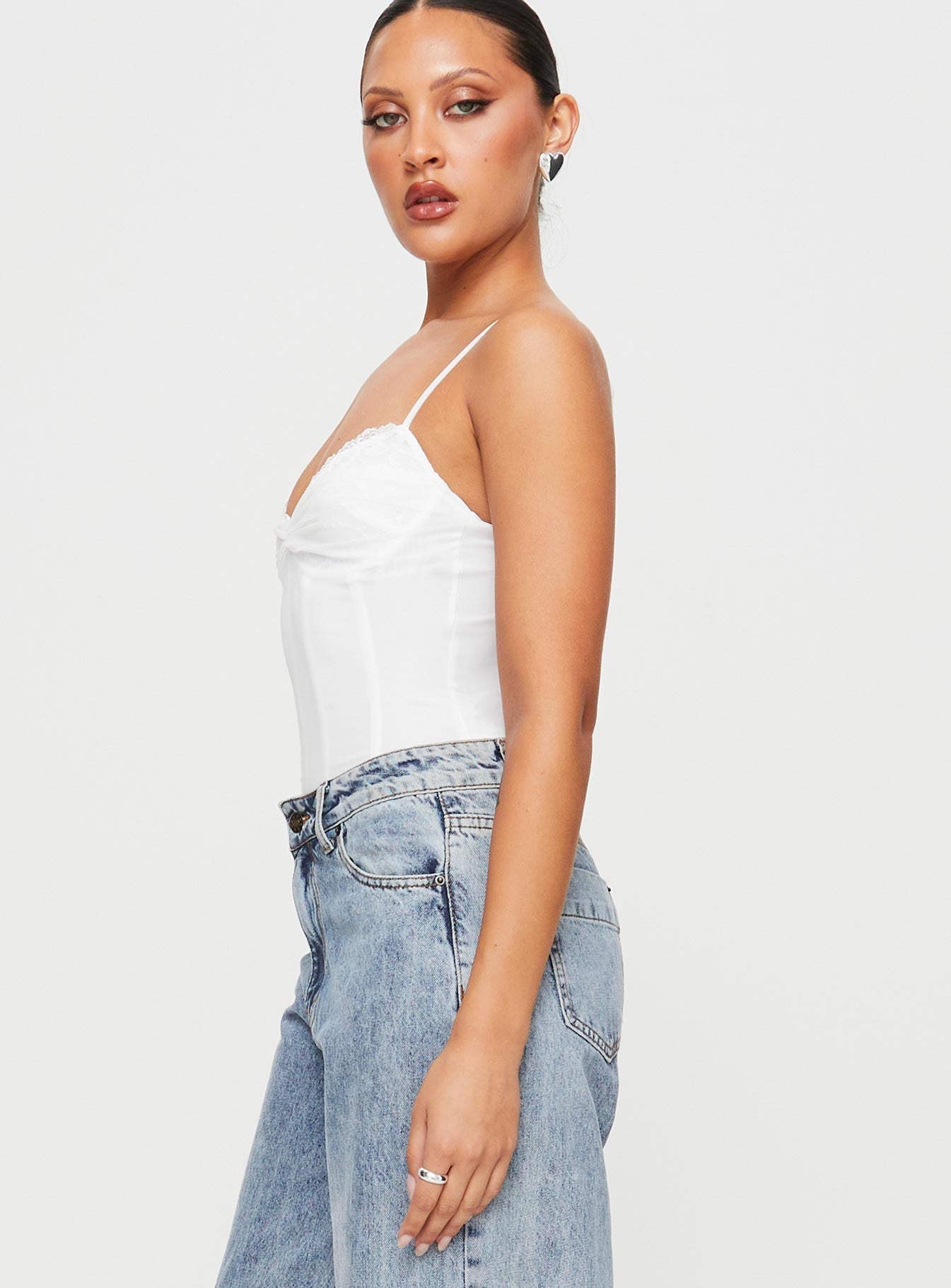 Mesh bodysuit Boning throughout, adjustable shoulder straps, sweetheart neckline, lace detail, wired cups, g-string style bottom, press clip fastening