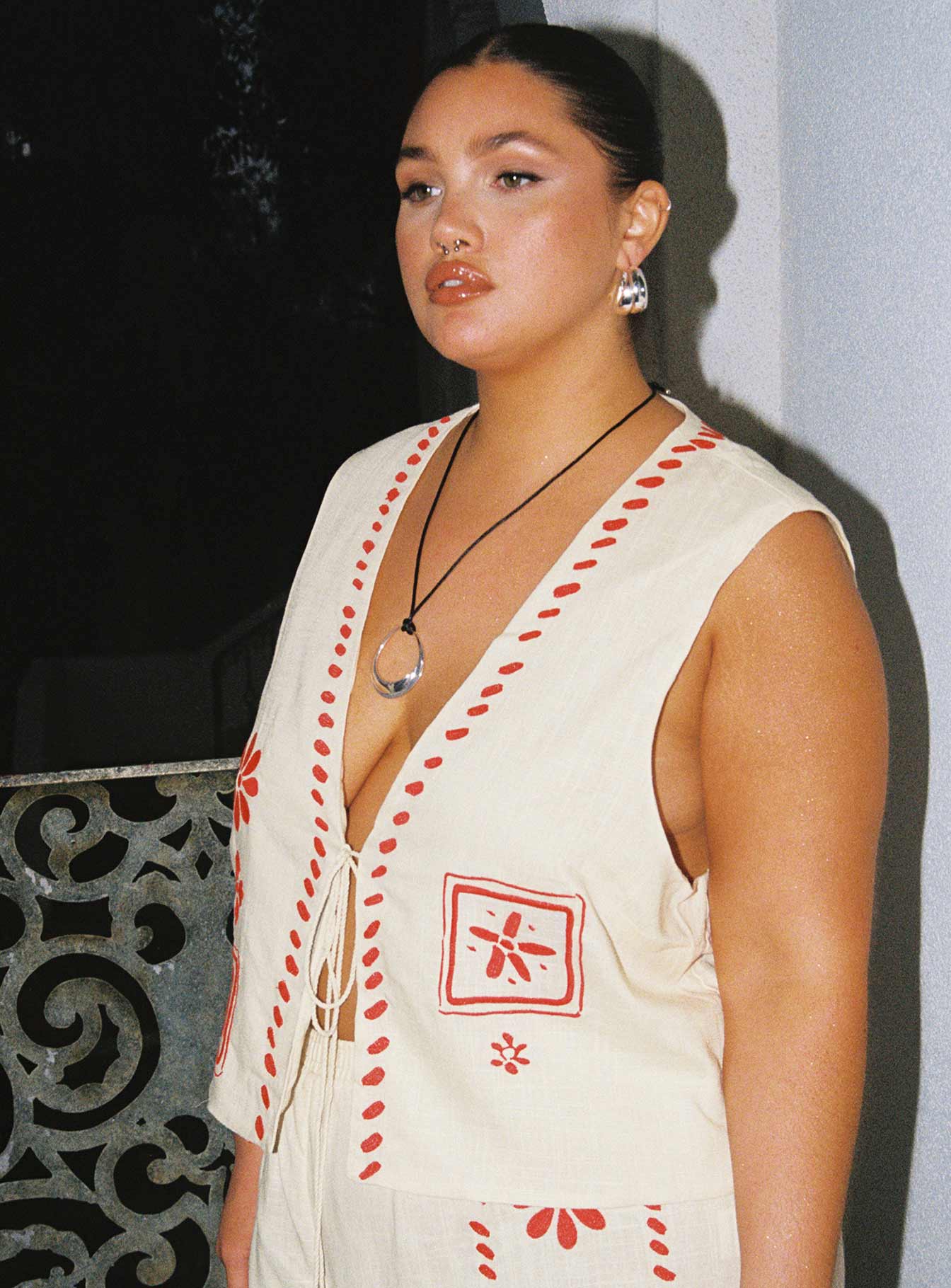 V neckline vest top Embroidered detail, tie closure with tassels