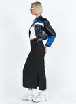 Black maxi skirt Low waist Belt looped waist Zip and button fastening Twin hip pockets Slit at side