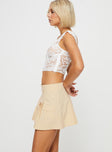 Cargo mini skirt  Pleated detail, two mini pocket design, belt lopped waist, invisible zip fastening at side