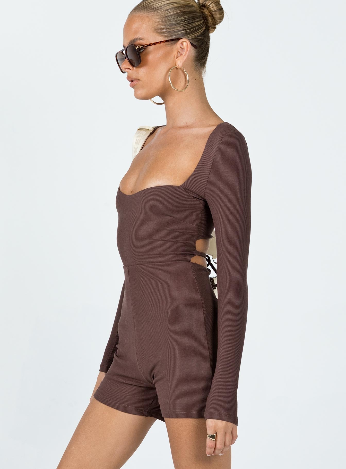 Romper Ribbed material  Square neckline  Cut out back  Tie fastening at back 