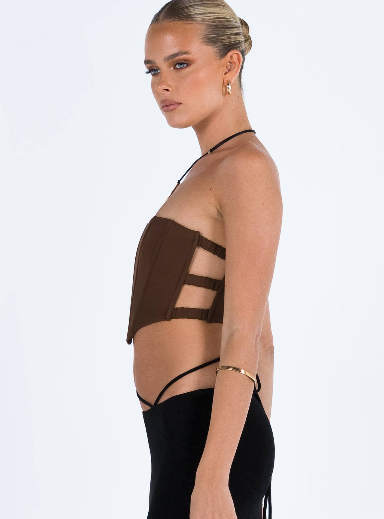 Strapless top Boning throughout Pointed hem  Inner silicone strip at bust  Zip fastening at back  Elasticated side straps  Good stretch  Fully lined 