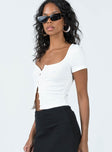 Top Ribbed material Scoop neckline Button fastening at front