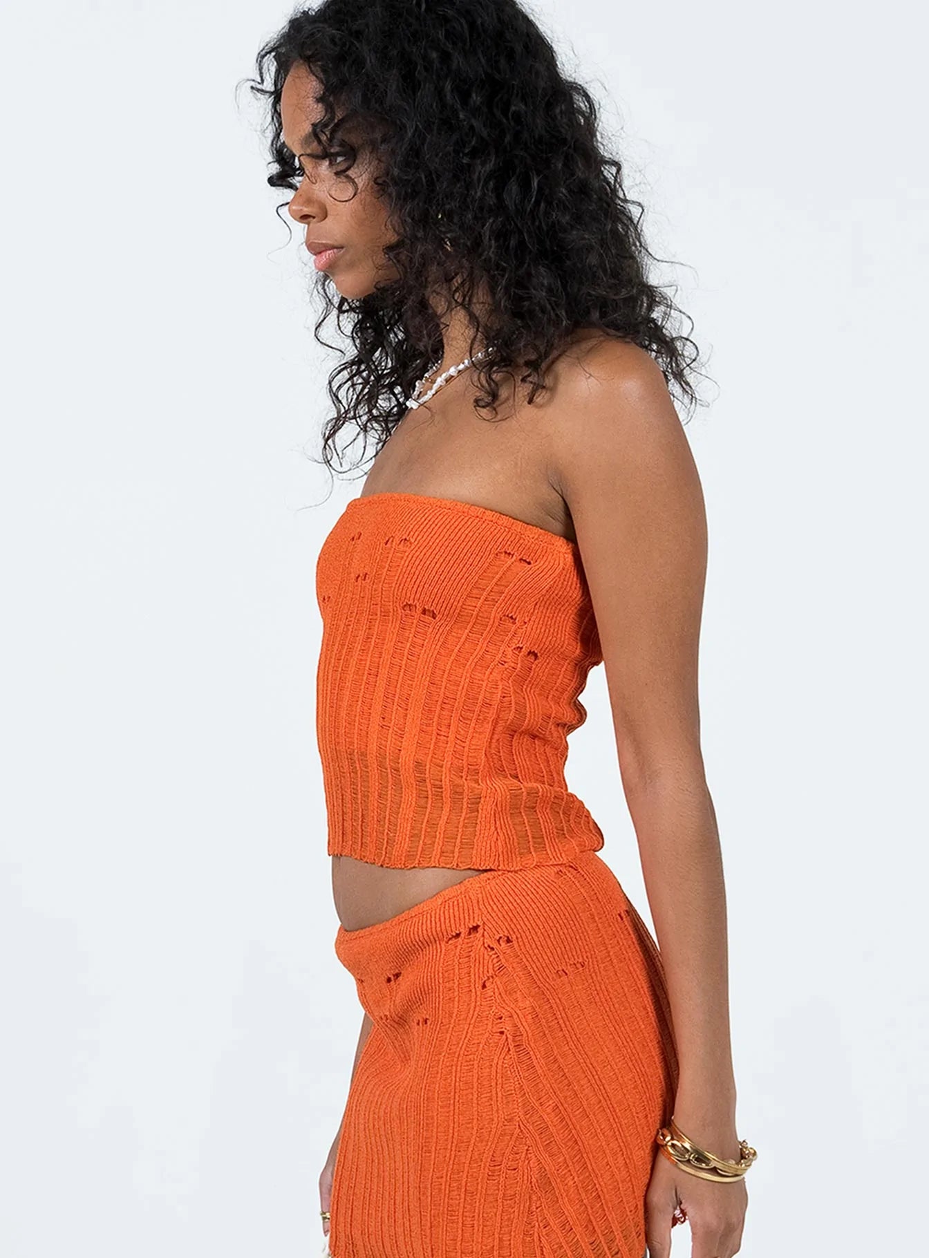 Tube top Knit material Distressed detail Good stretch 