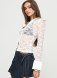 Long sleeve top Collared, lace material, button fastening Good stretch, unlined, sheer