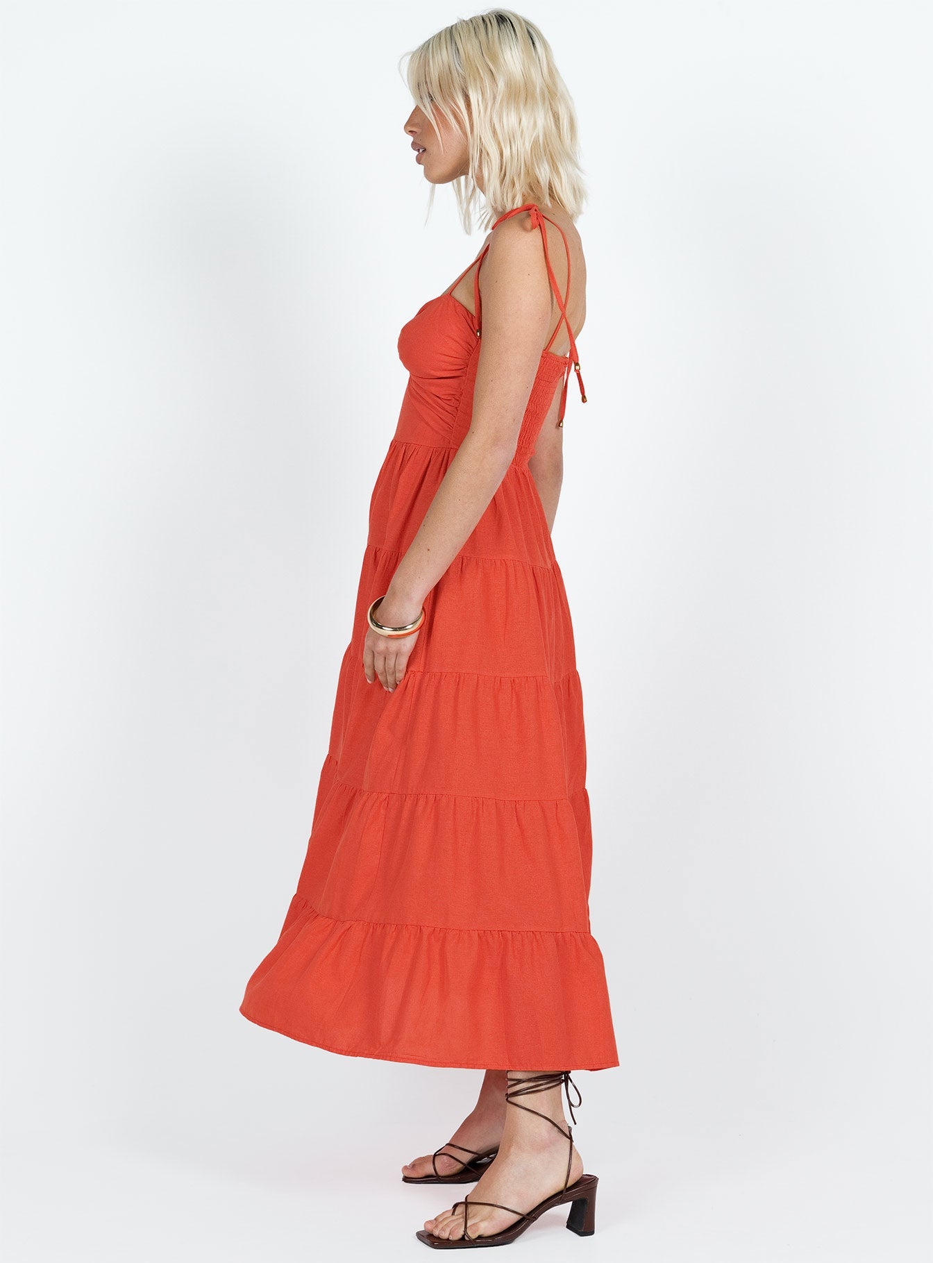 Midi dress Tie fastening shoulder straps Knot detail at bust Shirred band at back Cut out at waist Invisible zip fastening at back Tiered skirt