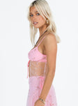 Pink top Sheer mesh material Floral embellishments Adjustable shoulder straps Open front Tie fastening at bust