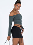 Black mini skirt Low rise Asymmetric waist Tie fastening at waist Invisible zip fastening at side
