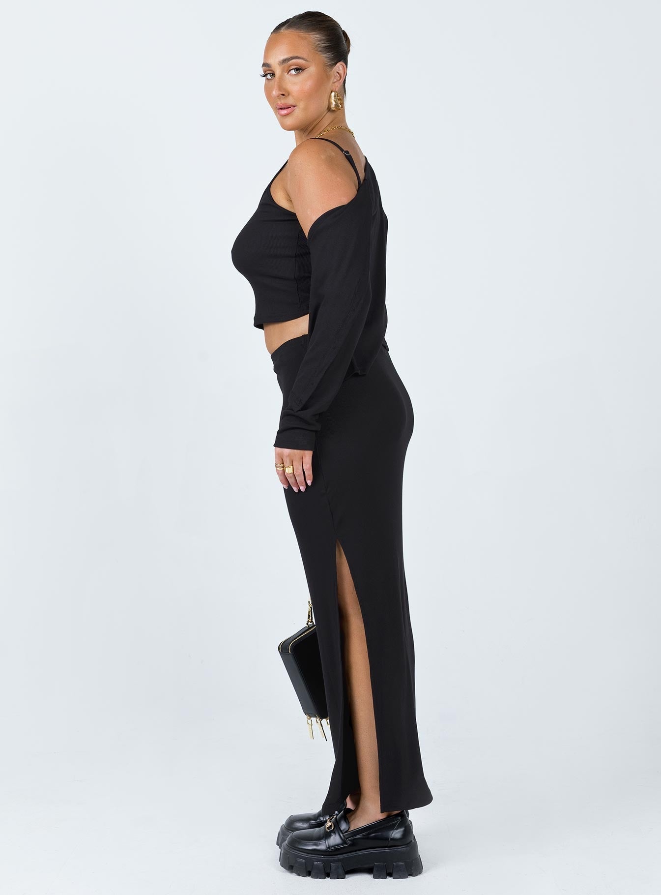 Matching three piece set Ribbed material Long sleeve cardigan  Button fastening at front Crop top Scoop neckline Adjustable shoulder straps Midi skirt Elasticated waistband Slit at side