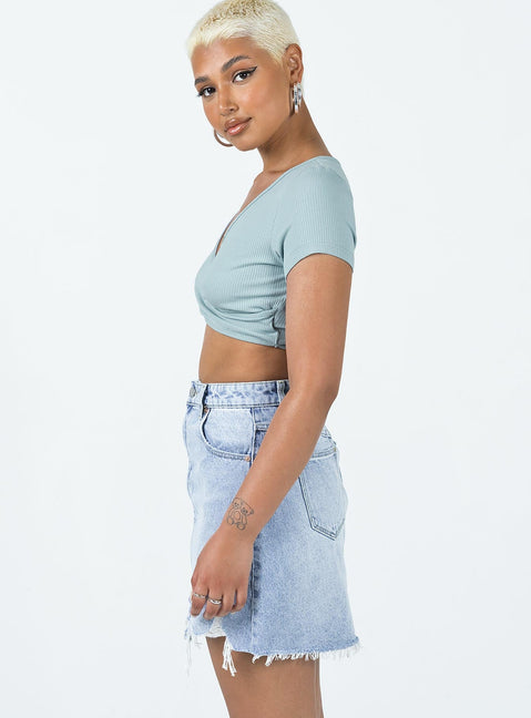 Mini skirt Mid-wash denim A-line design High waisted  Classic five pocket design Zip & button fastening Belt looped waist Raw edge hem Distressed detail