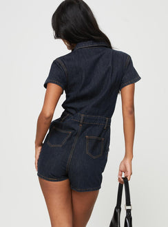 Dark wash denim romper Classic collar, button fastening at front, twin chest & hip pockets, belt looped waist, back pockets