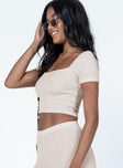 Beige crop top 90% nylon 10% spandex  Soft textured material  Can be worn on or off the shoulder  Good stretch  Unlined 