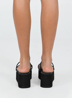 Sandals Faux leather Smooth finish Strappy upper Single toe loop Rounded toe Platform base