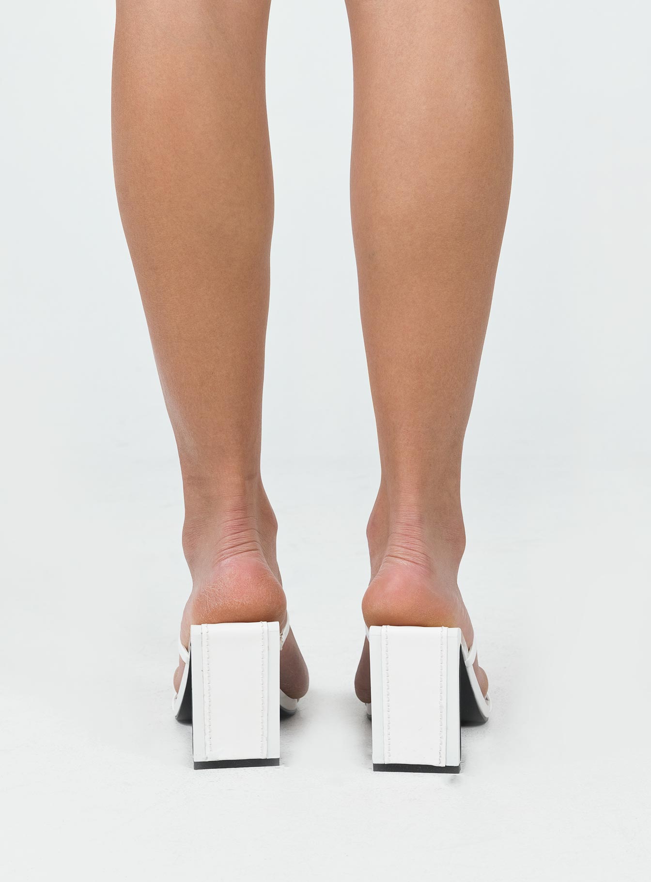 Heels Faux patent leather  Strappy upper  Shaved block heel Square toe 