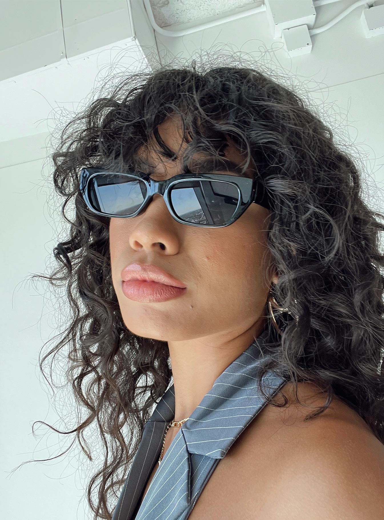 Sunglasses  100% plastic  UV 400 Slim style Transparent frame  Moulded nose bridge  Grey tinted lenses 