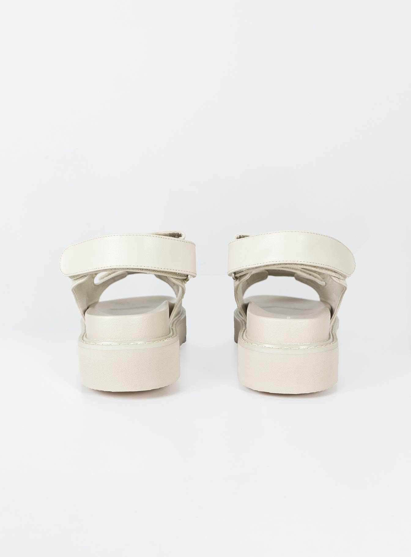 Sandals Faux leather material Twin velcro upper Ankle strap with velcro fastening Chunky treaded sole Padded footbed