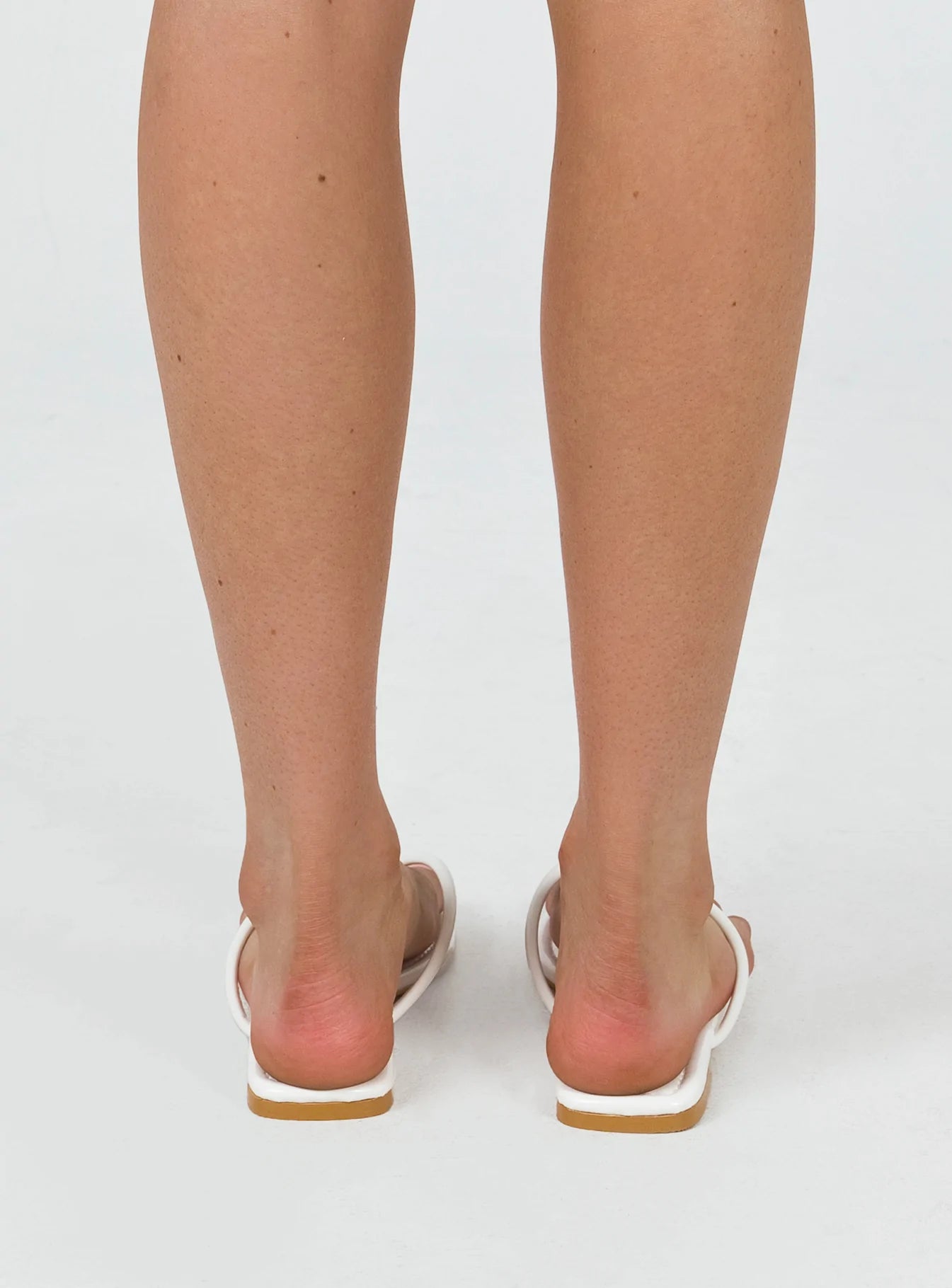 Sandals Faux patent leather material Flip-flop style upper Square tie Padded footbed