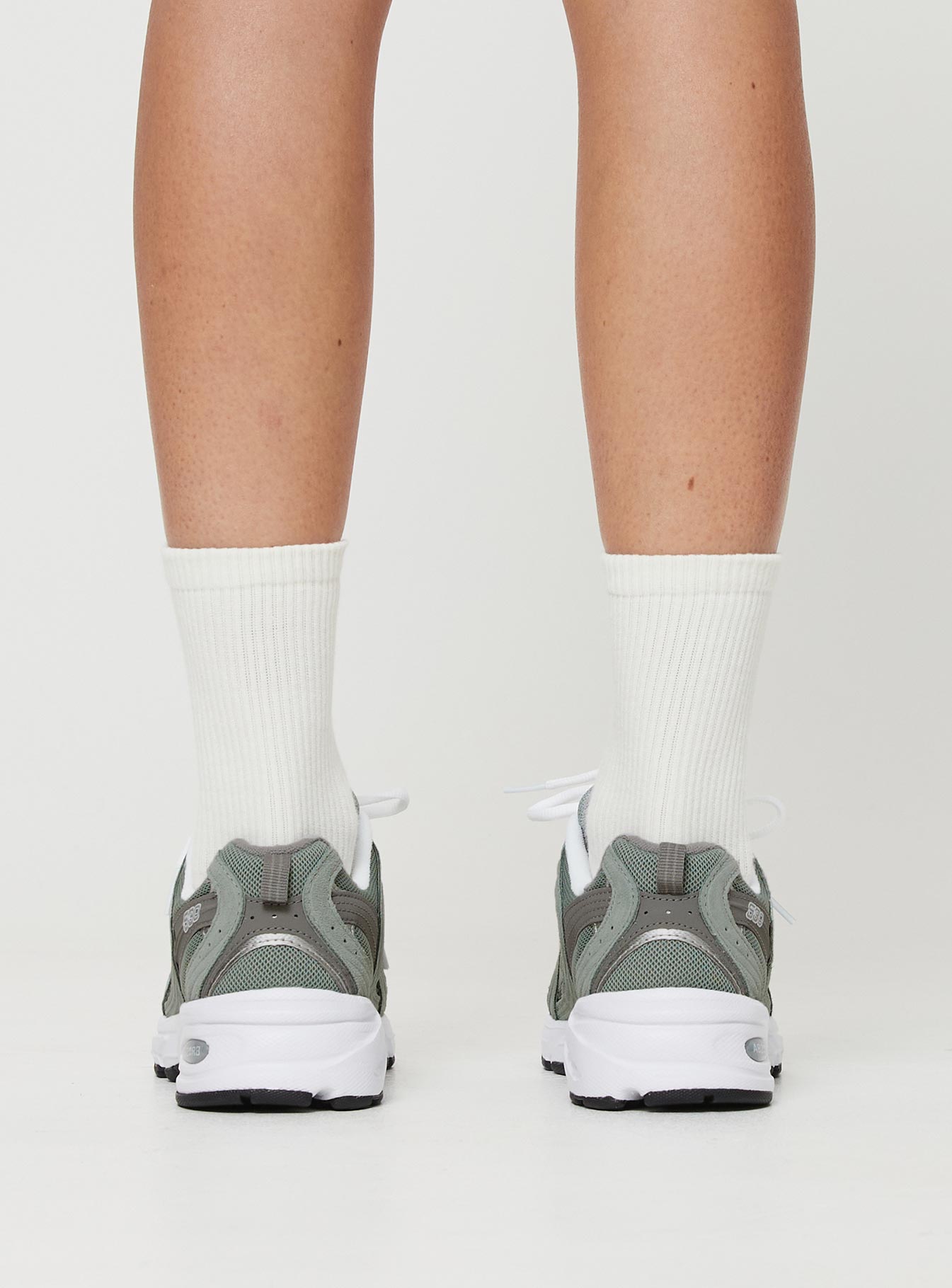 Sneakers Mesh netting throughout, lace up fastening, pull tab at heel, treaded sole, padded footbed