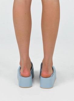 Sandals Faux leather  Wide upper  Slit at side for movement Square toe  Padded footbed  Platform base 