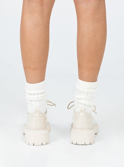 Shoes Faux leather material  High shine  Lace up  Rounded toe  Pull tab at heel  Platform base  Treaded sole 