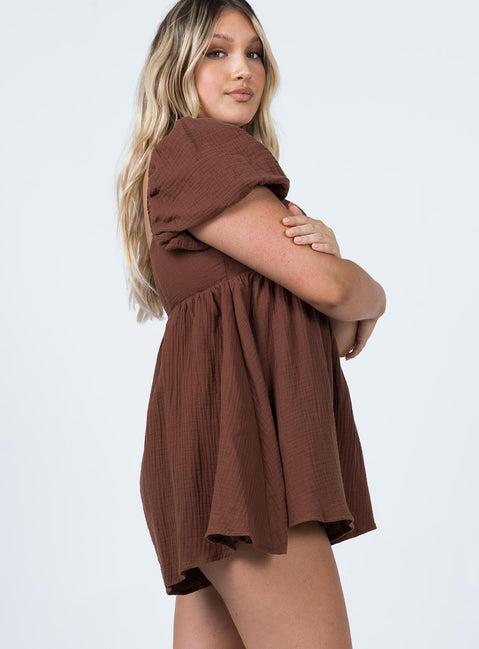 Romper Muslin material Square neckline  Elasticated puff sleeves Shirred back panel Invisible zip fastening at back  Relaxed leg 