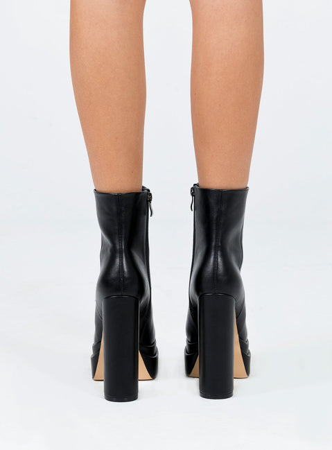 Black boots Faux leather material Zip fastening at side Square toe Platform base Block heel