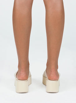 Sandals Single wide upper  Platform base  Rounded toe 