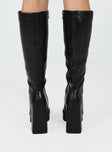 Knee high boots Faux matte leather Platform base Squared toe Thick flared heel Zip fastening at side