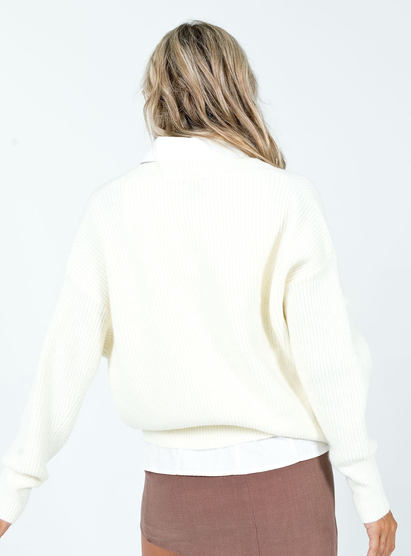 Sweater  Relaxed fit  97% recycled post consumer polyester 3% conventional elastane Soft knit material  Delicate material - wear with care  V neckline  Button front fastening  Drop shoulder  Good stretch  Unlined 