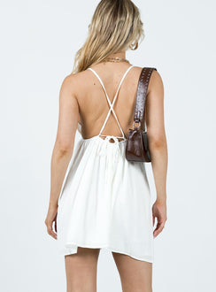 Mini dress Crinkle material Adjustable shoulder straps with tie fastening Plunging neckline Elasticated band at waist Low back