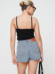 Denim mini skort, high rise Belt looped waist, five classic pockets, button fastening at front, zip fastening Non-stretch material, unlined 