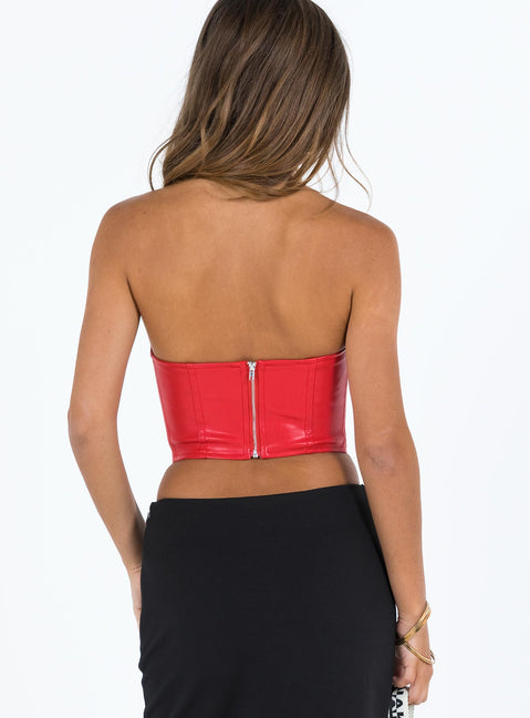 Red bustier Faux leather material Strapless design  Boning through front  Pointed hem  Zip fastening at back  Fully lined 