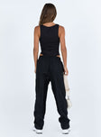 Black pants Windbreaker material Elasticated waistband Twin hip pockets Elasticated cuffs