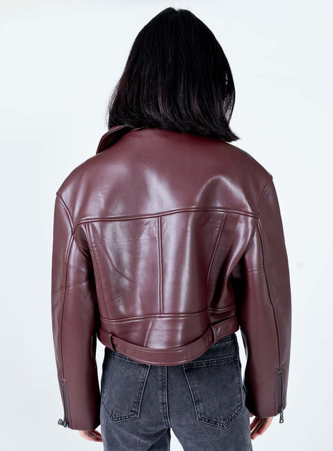 Oversized jacket Faux leather material  Lapel collar  Zip front fastening Twin hip pockets Removable buckle belt Zip at cuffs 