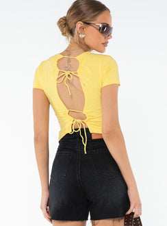 Graphic print tee Cap sleeve, adjustable cut-outs at back with tie fastening