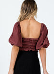Crop top Elasticated neckline & waist Can be worn on or off the shoulder Puff sleeves Tie detail at front Frill hem 