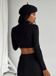 Long sleeve top Ribbed material Turtle neck design Scooped hem