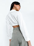White cropped shirt Linen look material Classic collar Button front fastening Cropped design Elasticated waistband at back Single button cuff slightly sheer