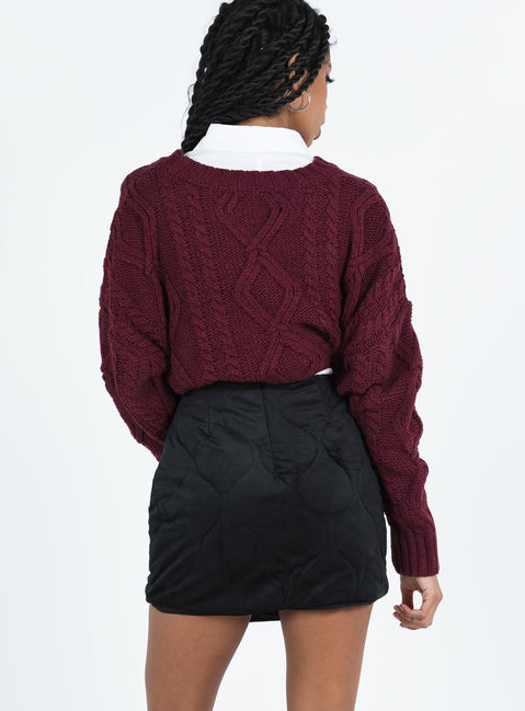 Black mini skirt Quilted material High rise Invisible zip fastening at back Button detail at front