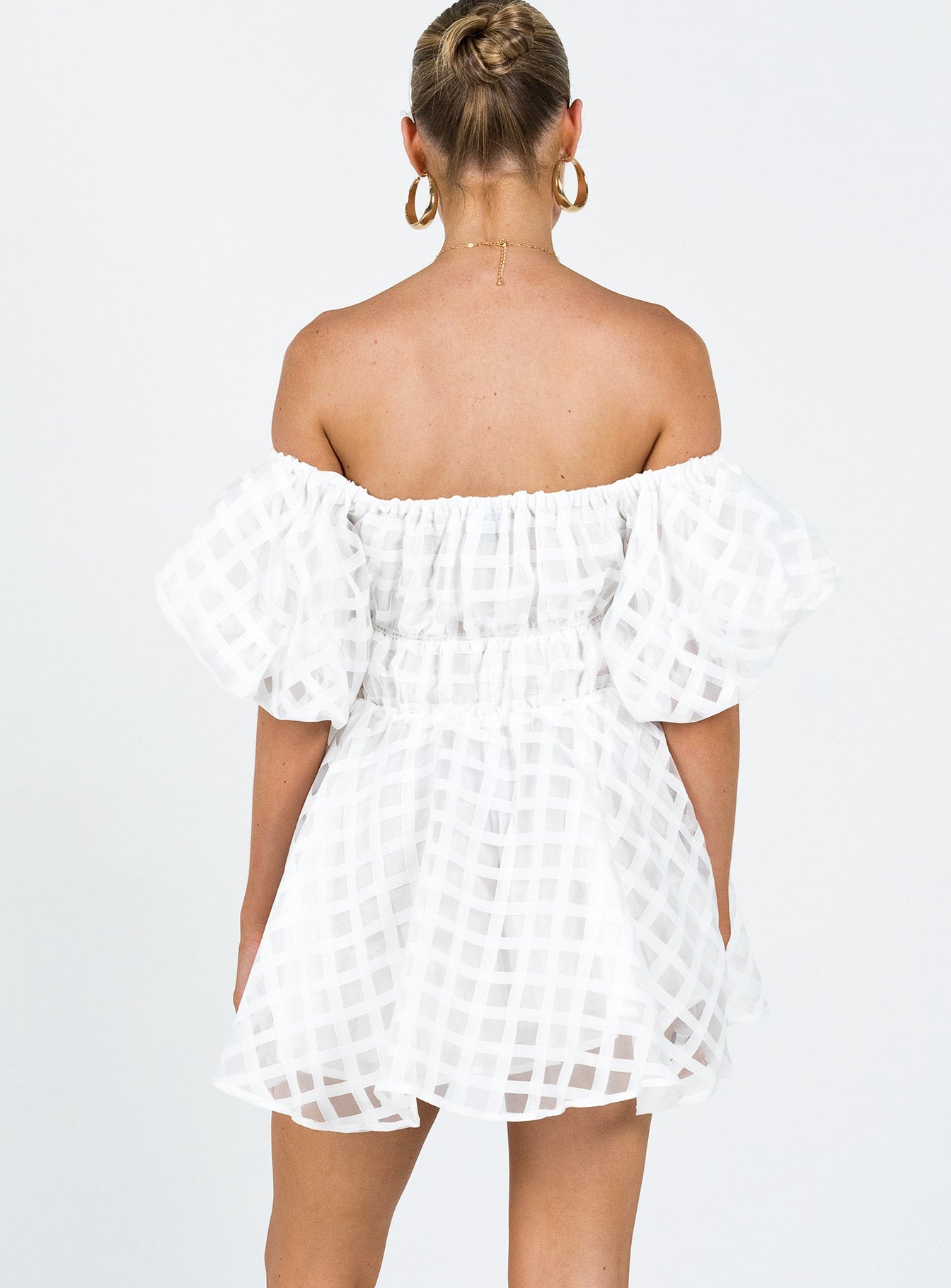 White mini dress Sheer material Off the shoulder design Puff sleeve Elasticated bands at waist