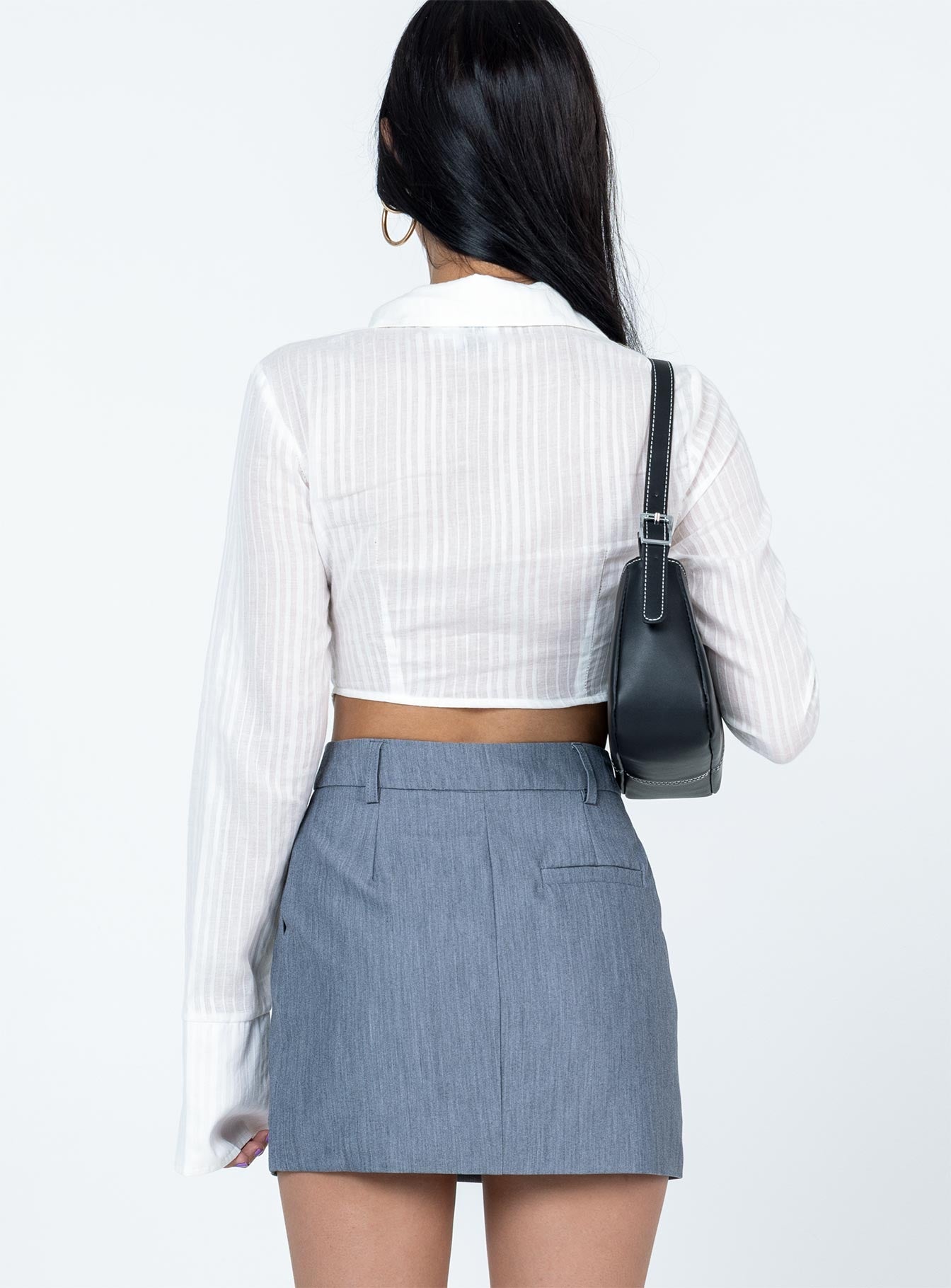 Long sleeve top Sheer material  Classic collar  V neckline  Single bust fastening at bust  Pointed hem  Flared cuffs