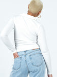 White long sleeve top Ribbed material  Classic collar  Double ended zip fastening 
