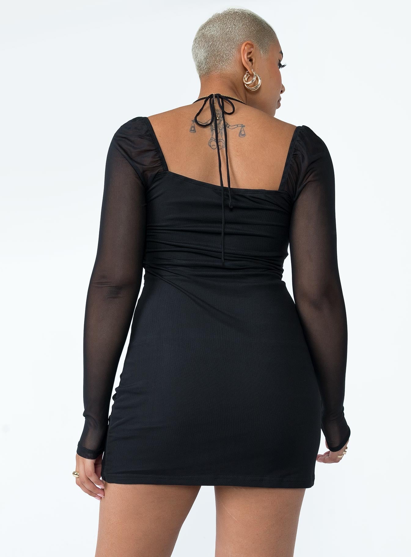 Long sleeve mini dress Sheer mesh sleeves  Halter neck tie fastening  Adjustable tie at bust 