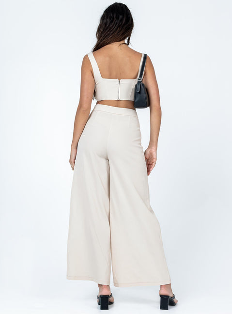 Matching set Silky material  Corset top  Boning through front  Zip fastening at back  High waisted pants  Invisible zip fastening at side  Wide leg 