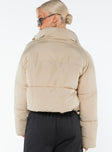 Cropped puffer jacket High neckline, zip and press button fastening at front, twin hip pockets, drawstring waist