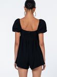 Black romper Muslin look material Square neckline Elasticated puff sleeves Shirred back panel Invisible zip fastening at back Relaxed leg