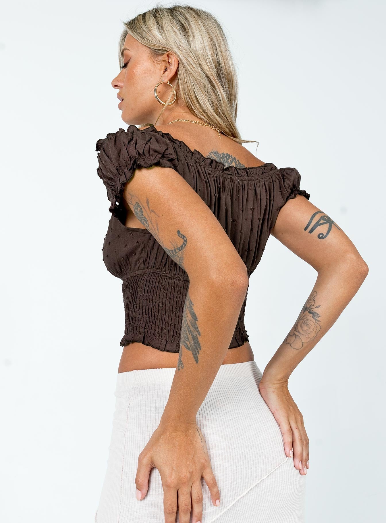 Crop top  Slim fitting  Princess Polly Exclusive 100% rayon  Can be worn on or off the shoulder  Elasticated neckline  Frill trim Shirred waist  Good stretch  Unlined 