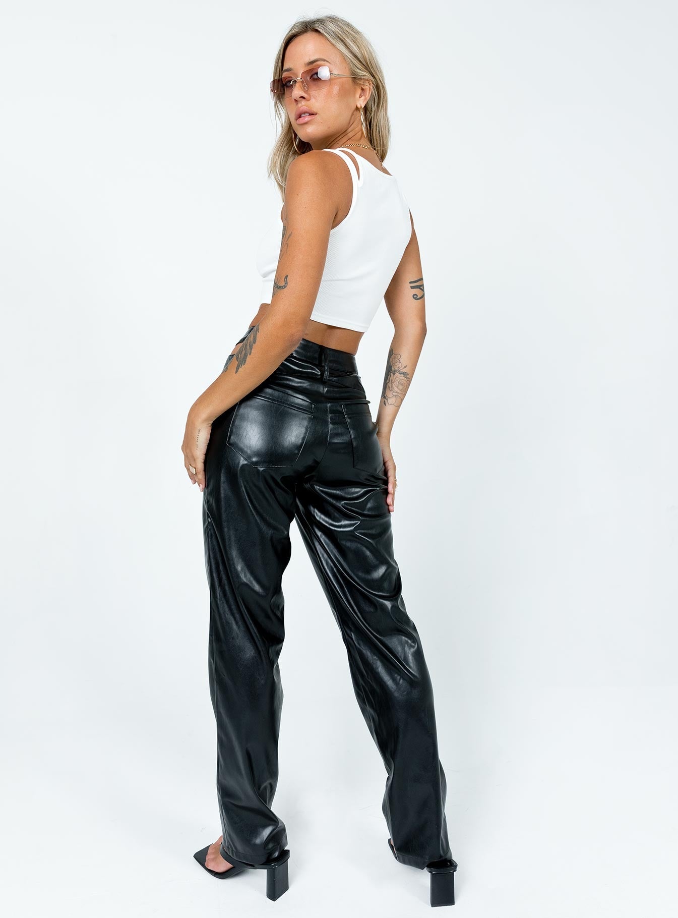 Pants Faux leather material  Semi-detached waistband  Zip & button fastening  Belt looped waist  Classic five-pocket design  Straight leg  Slight stretch 