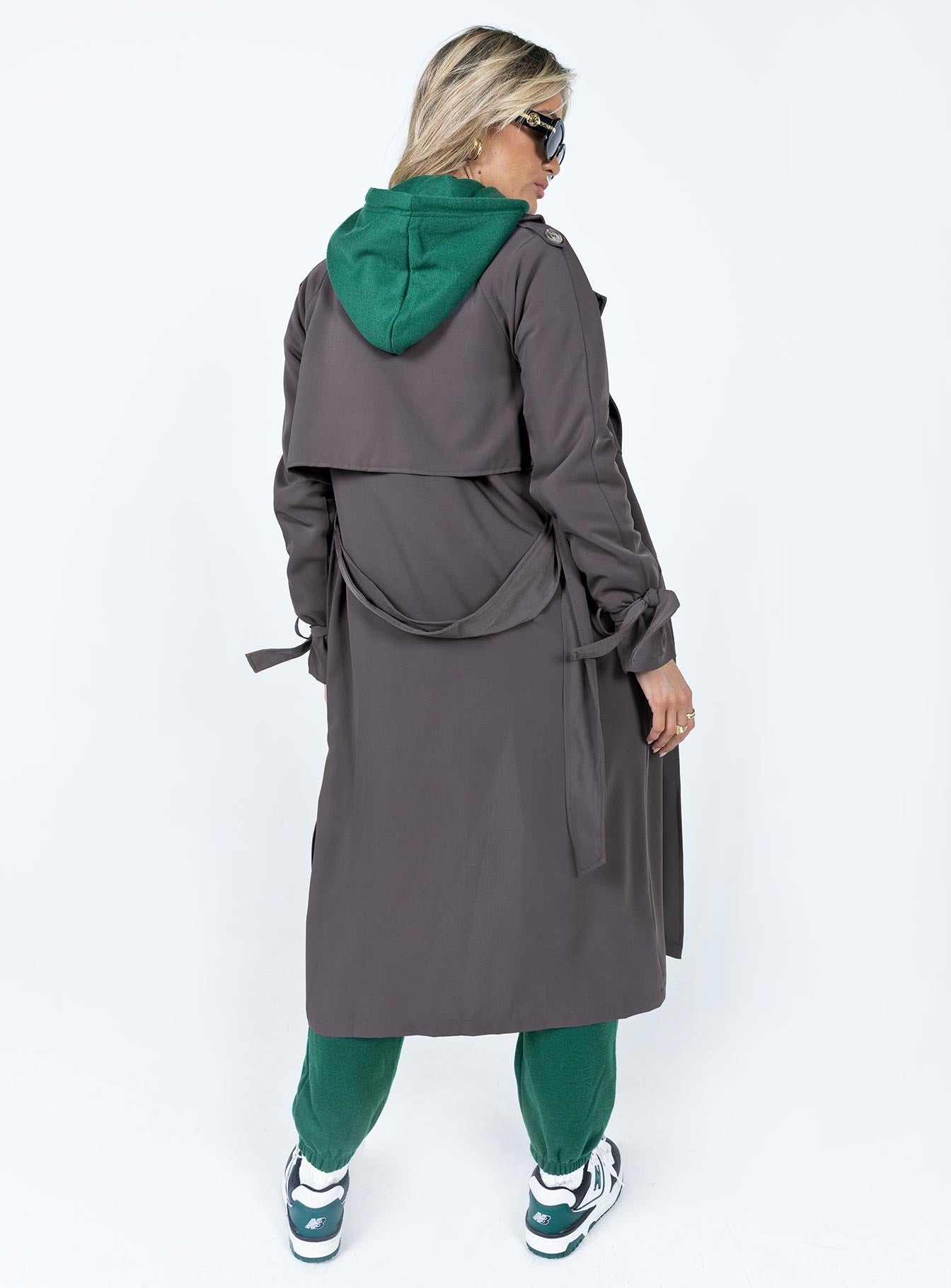 Trench coat Relaxed fit 100% polyester Wide lapel collar  Double-breasted front Tie fastening at cuffs  Belt loops with detachable belt Twin hip pockets